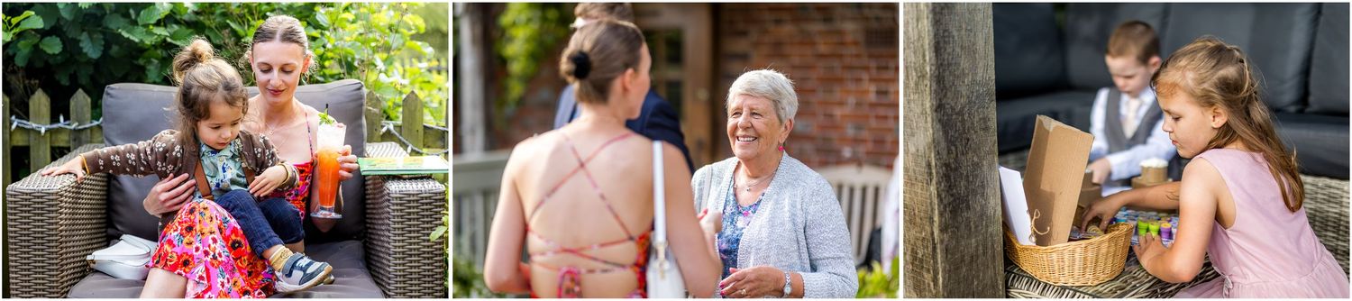 Outdoor garden party with guests mingling among floral decorations.