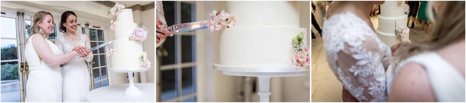Close-up details of white wedding cake and floral decorations.