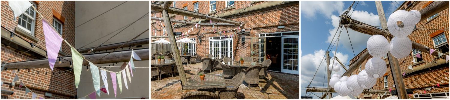 Wedding venue decorations featuring white bunting and outdoor seating arrangements.