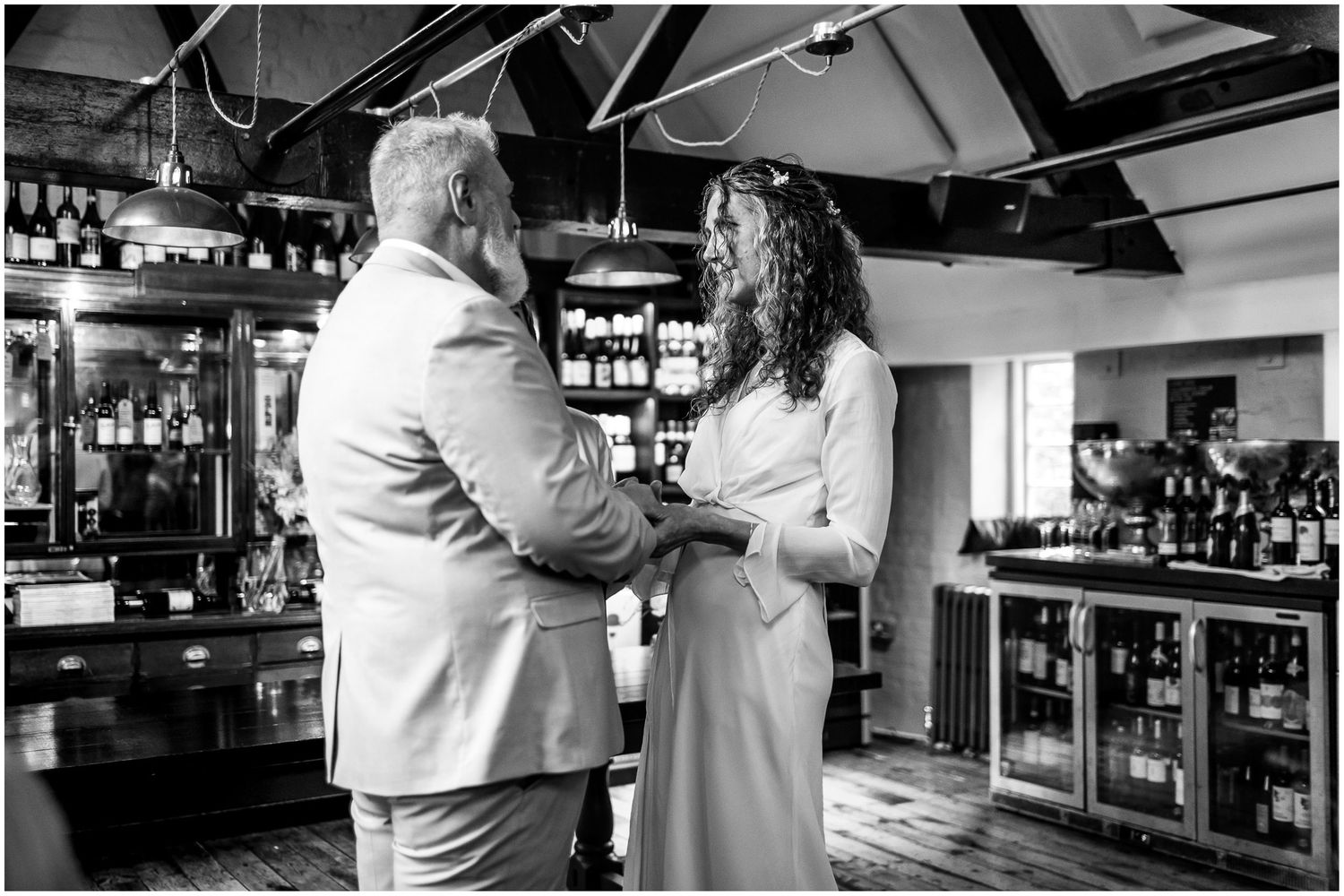 Black and white photograph of wedding couple at Abbey Mill reception venue in Hampshire.