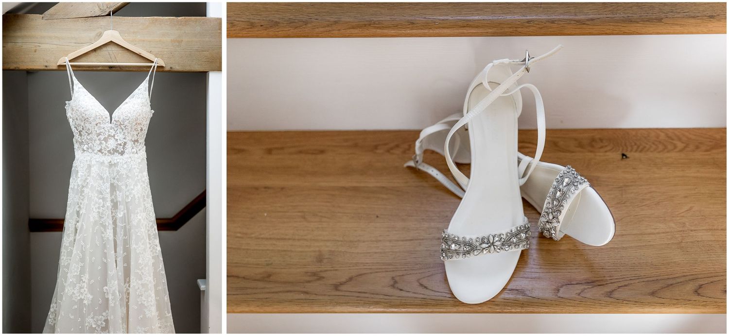 Wedding accessories including white dress, shoes and jewelry laid out on wooden surface.