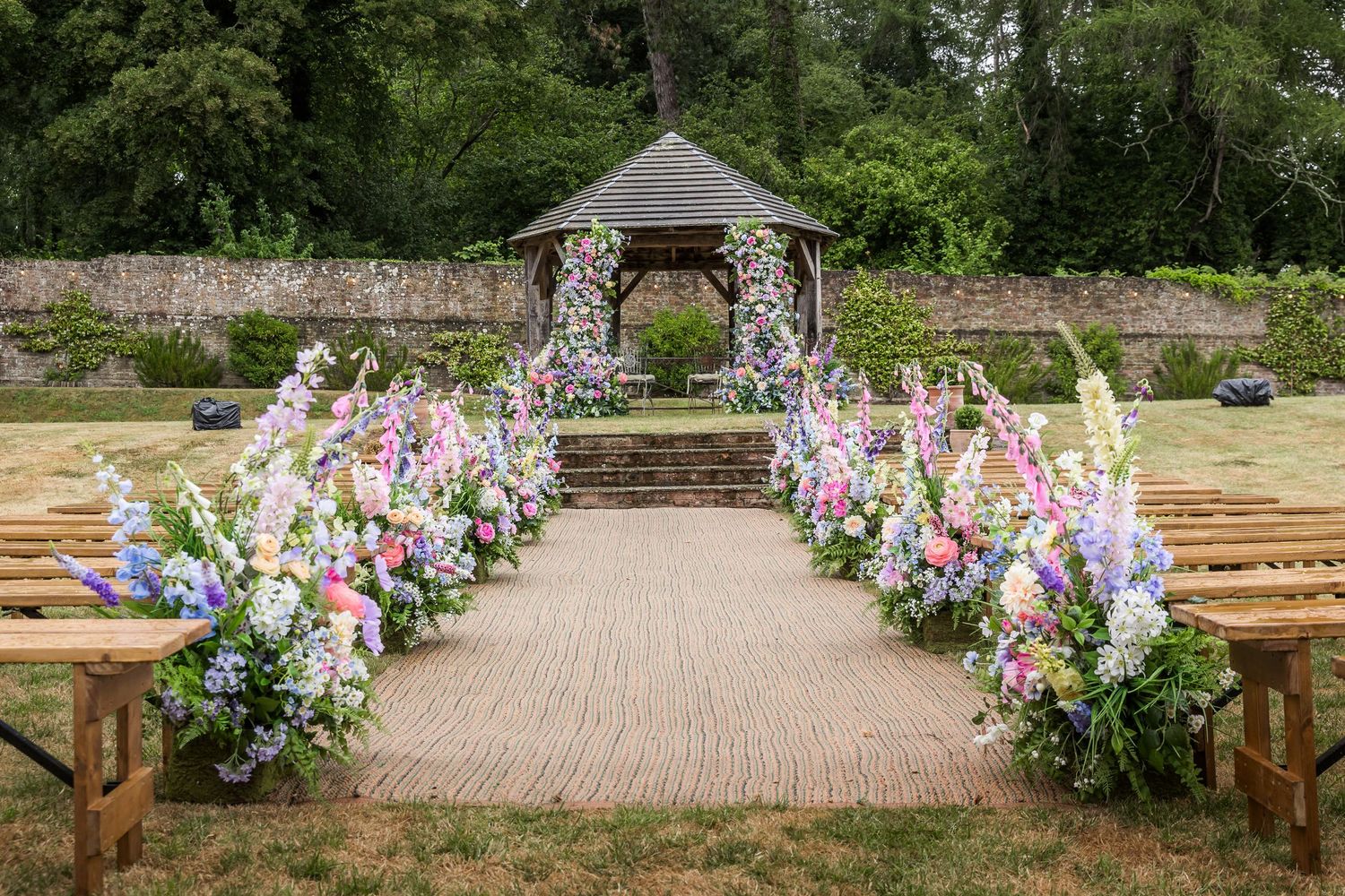 The outdoor ceremony area in the walled garden at the Holywell Estate wedding venue in Hampshire