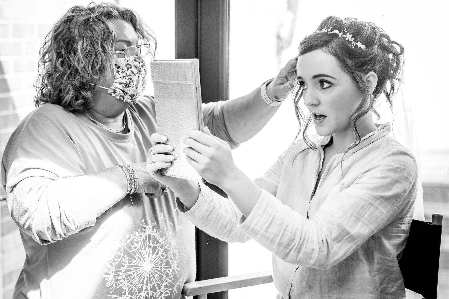 Black and white photo series showing intimate wedding moments of couple getting ready and embracing.