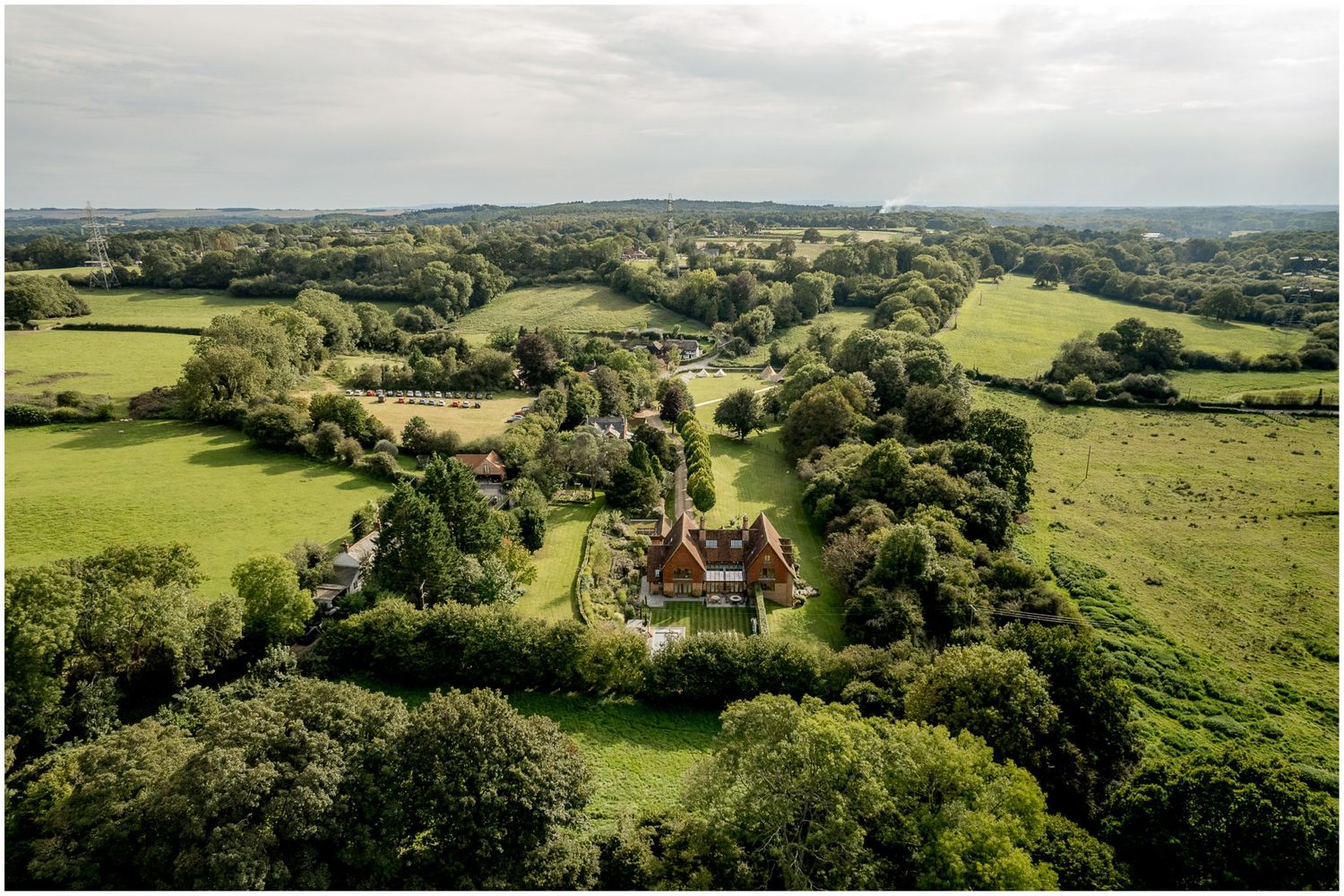 Panoramic view of rolling hills and countryside surrounding the wedding venue.