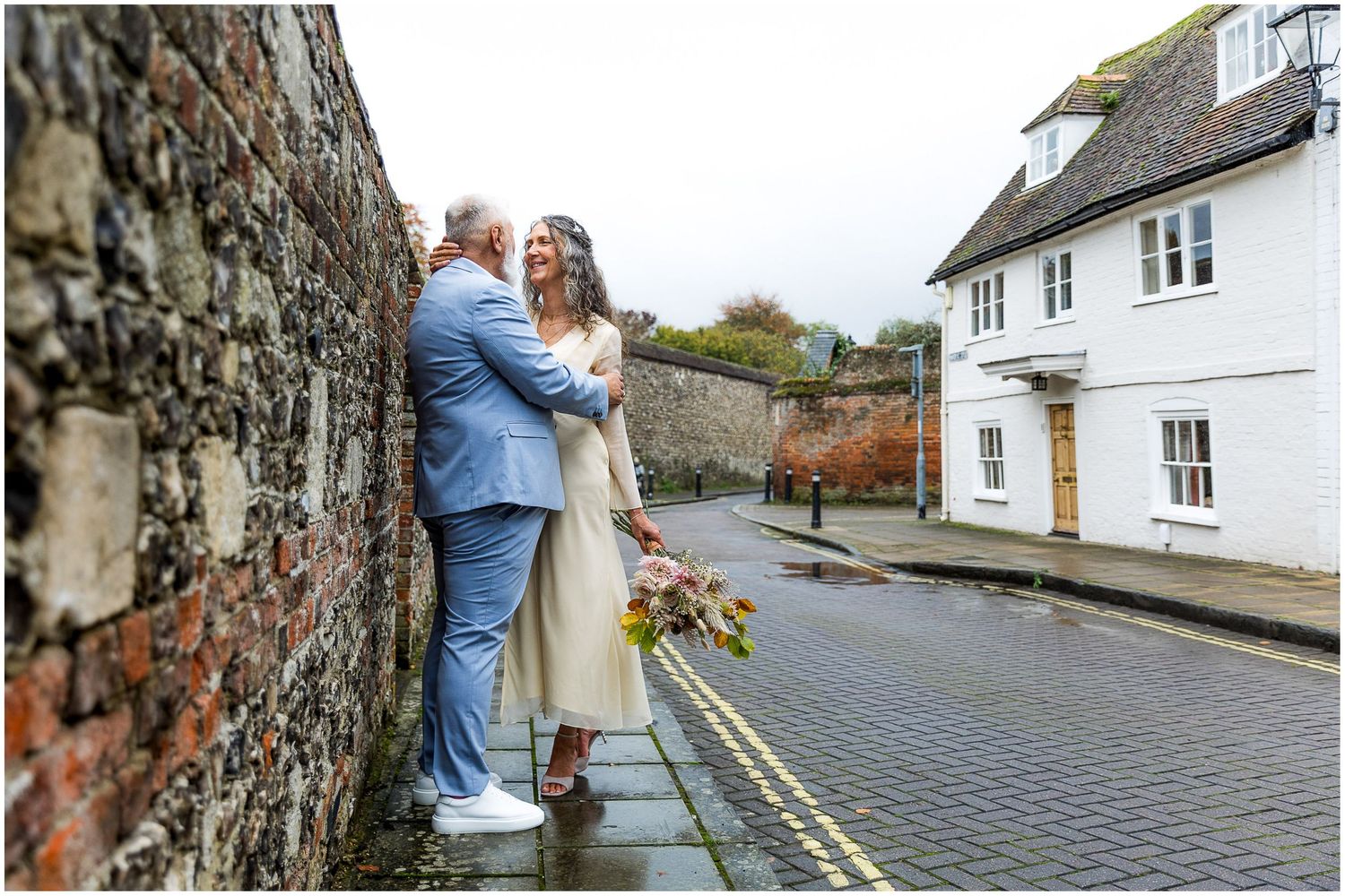 Couple wedding portrait in the ancient streets of Winchester.