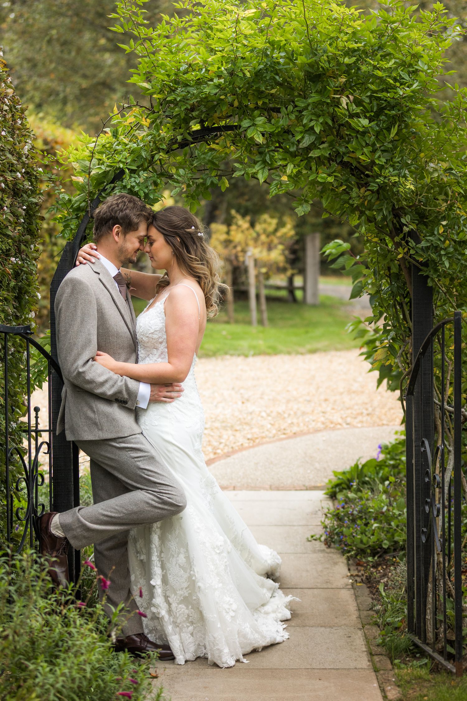 Bride and groom wedding portrait with the couple in the grounds of Click Barn in Hampshire