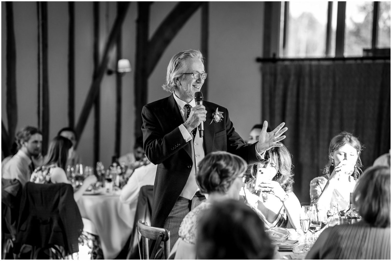 Black and white photos of wedding guests celebrating and dancing at an evening reception.