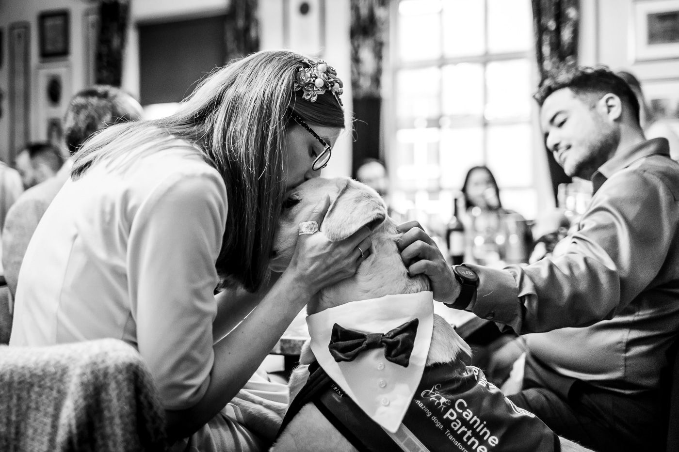 Intimate black and white candid moments captured during a wedding celebration.