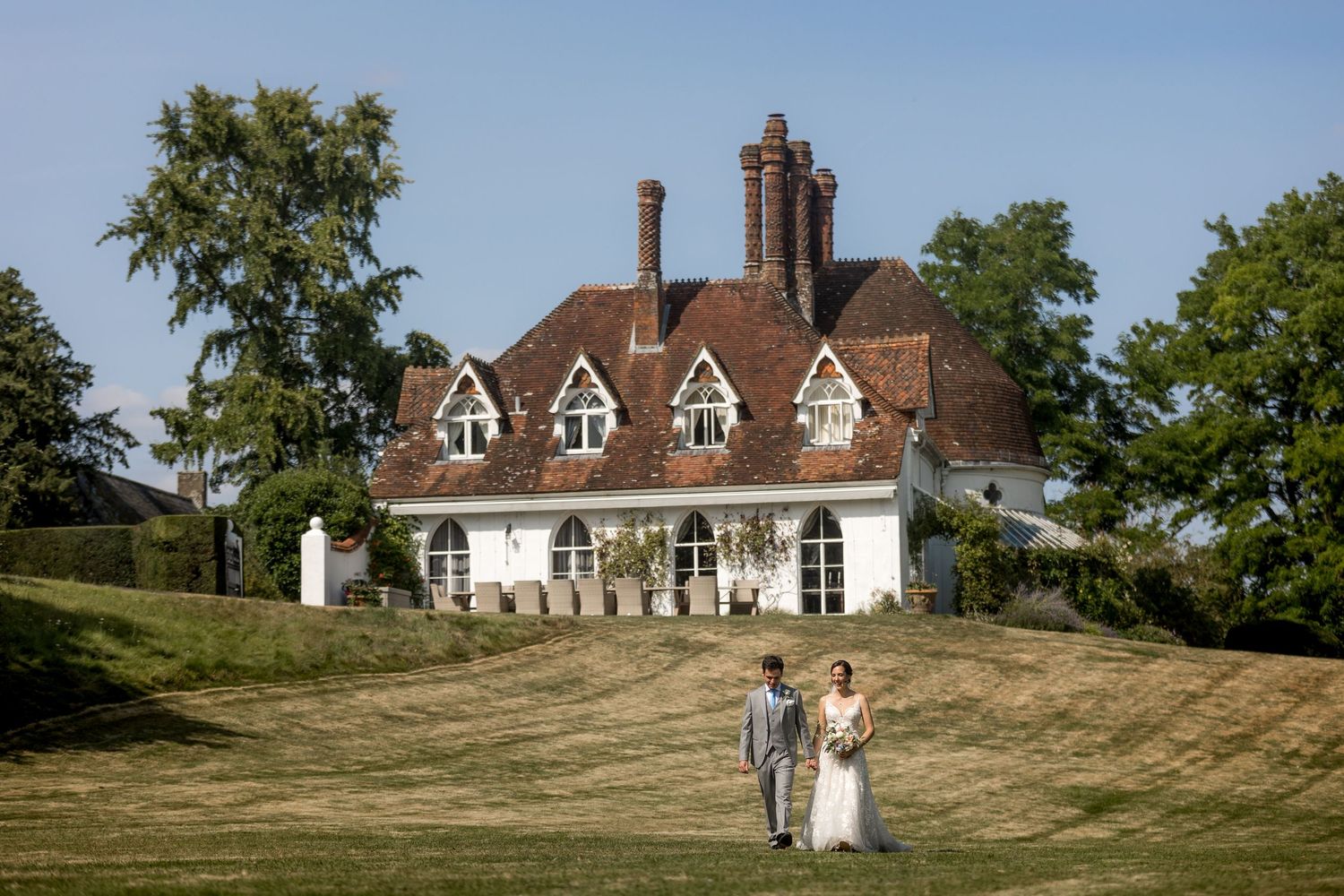 Scenic landscape of Houghton Lodge, Hampshire wedding venue, nestled among green hills and gardens.