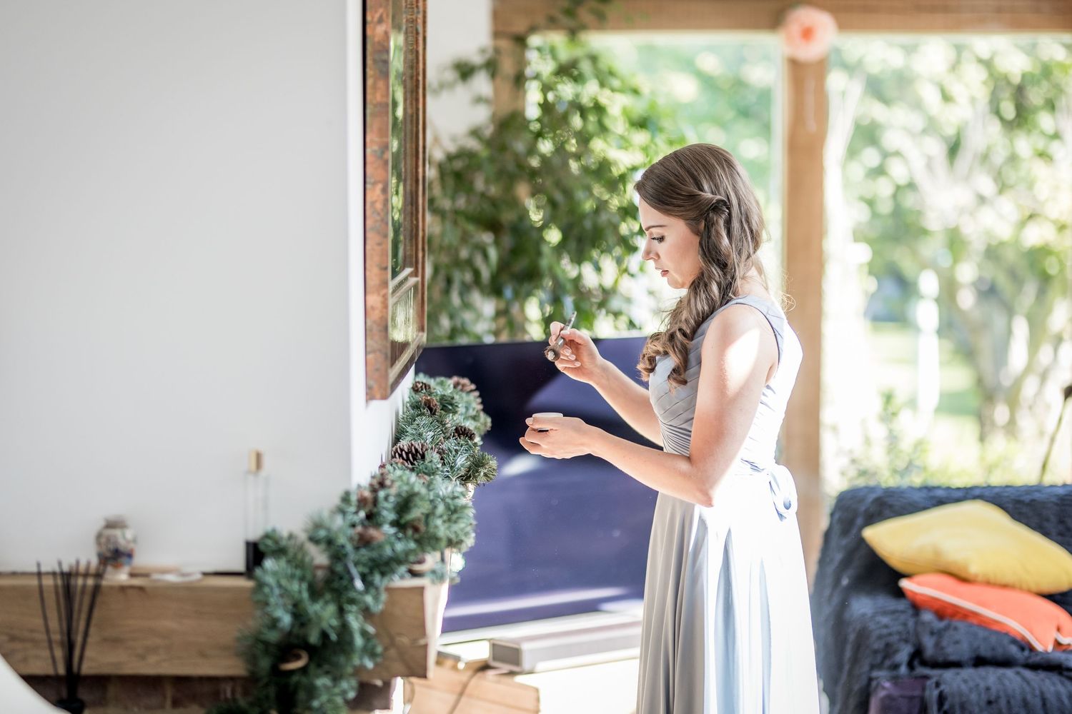 Interior of a bright sunlit room with wedding preparations underway.