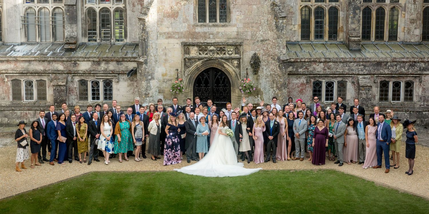 Dorset wedding photography with a large group photograph taken in the quad at Milton Abbey School