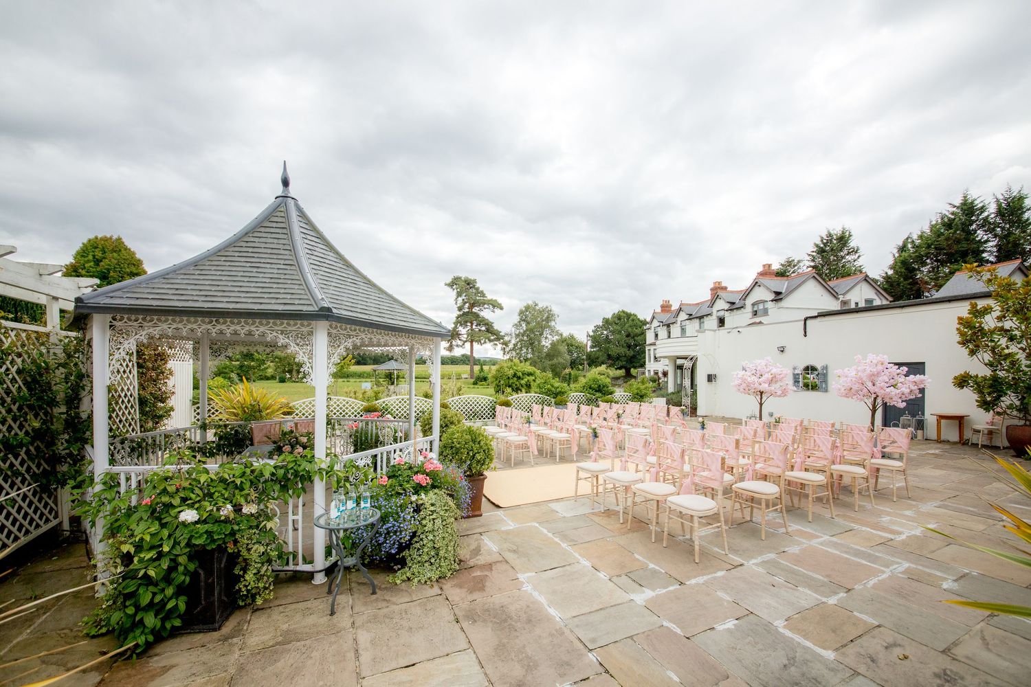 Wedding photograph of the outdoor ceremony space at Southdowns Manor on the Hampshire Sussex border near Petersfield