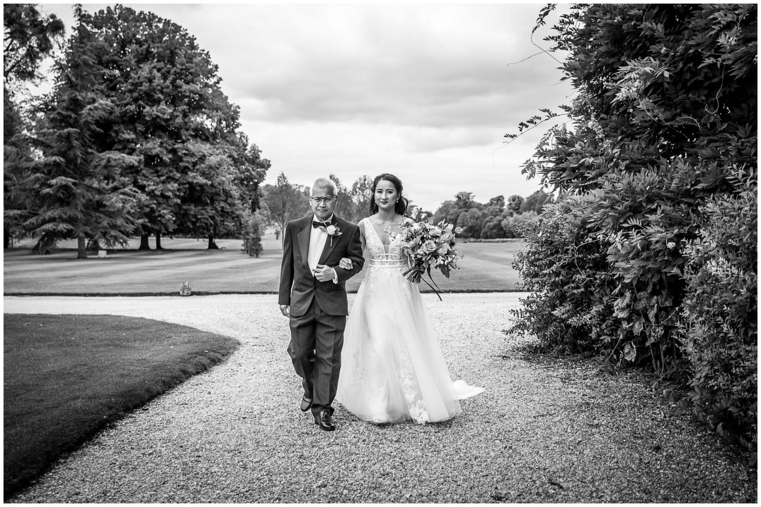 Black and white panoramic shots capture romantic moments on estate grounds.