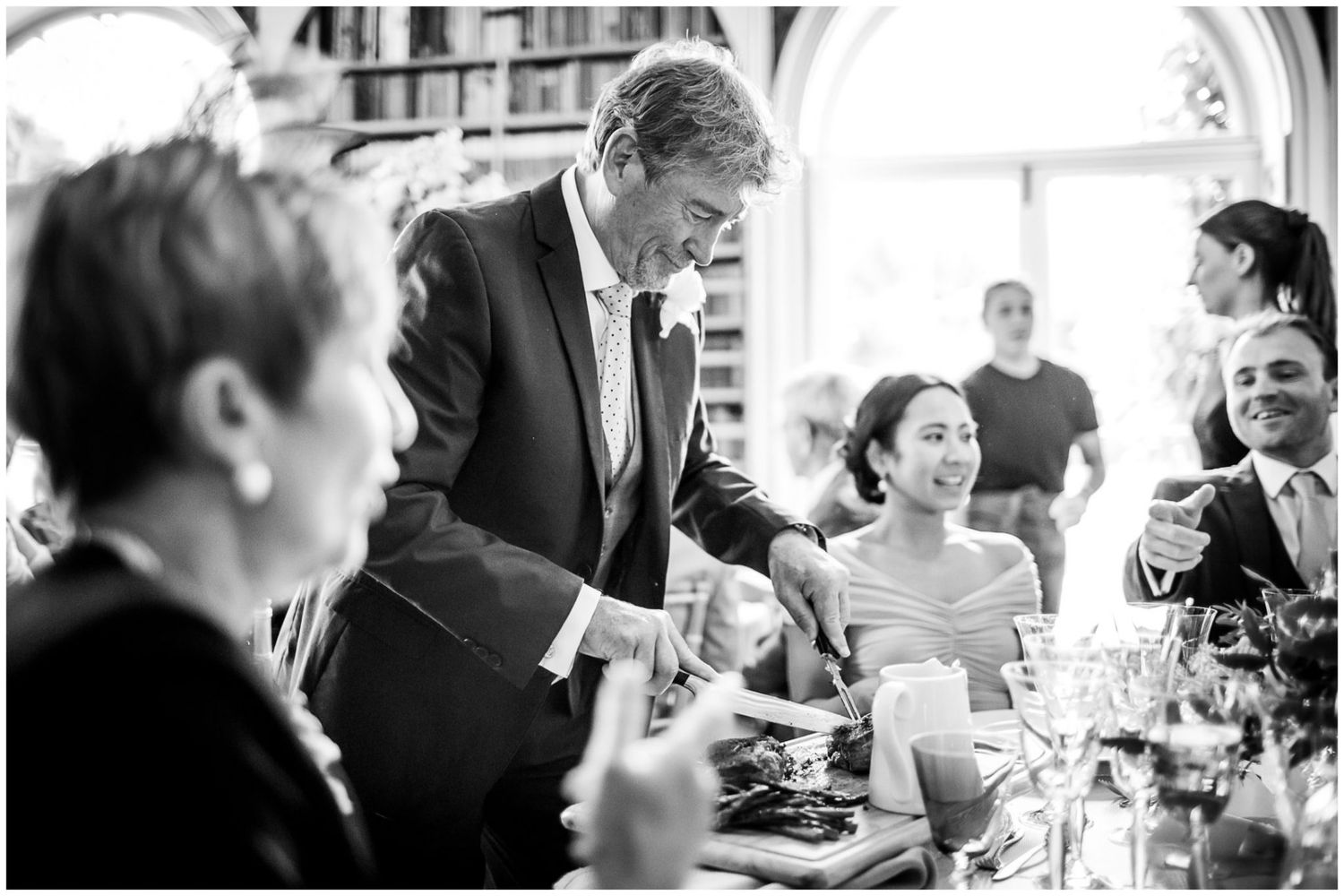 Black and white candid shots of wedding guests during reception.