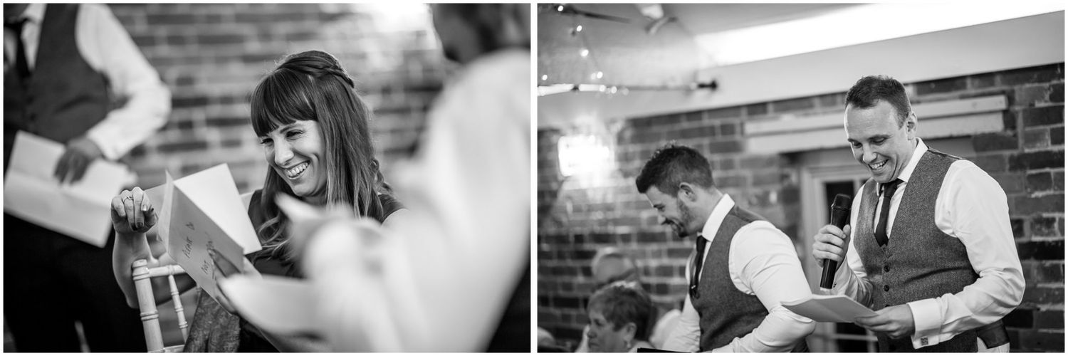 Black and white photo of wedding guests celebrating at a reception.