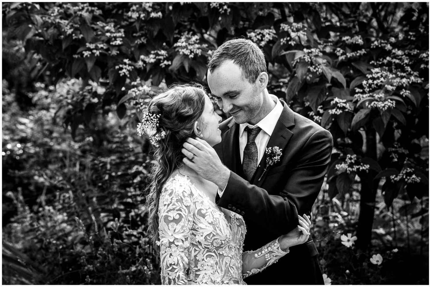 A romantic black and white photo sequence shows a couple sharing intimate moments in a garden setting.