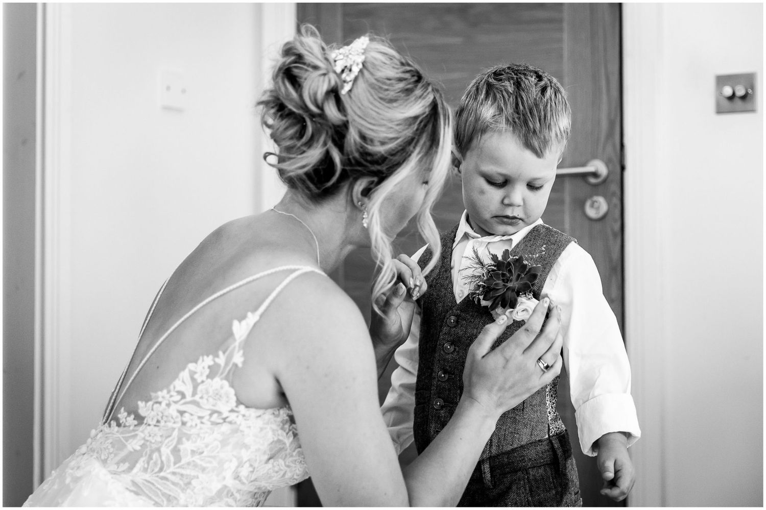 Black and white candid moments captured during wedding preparations.