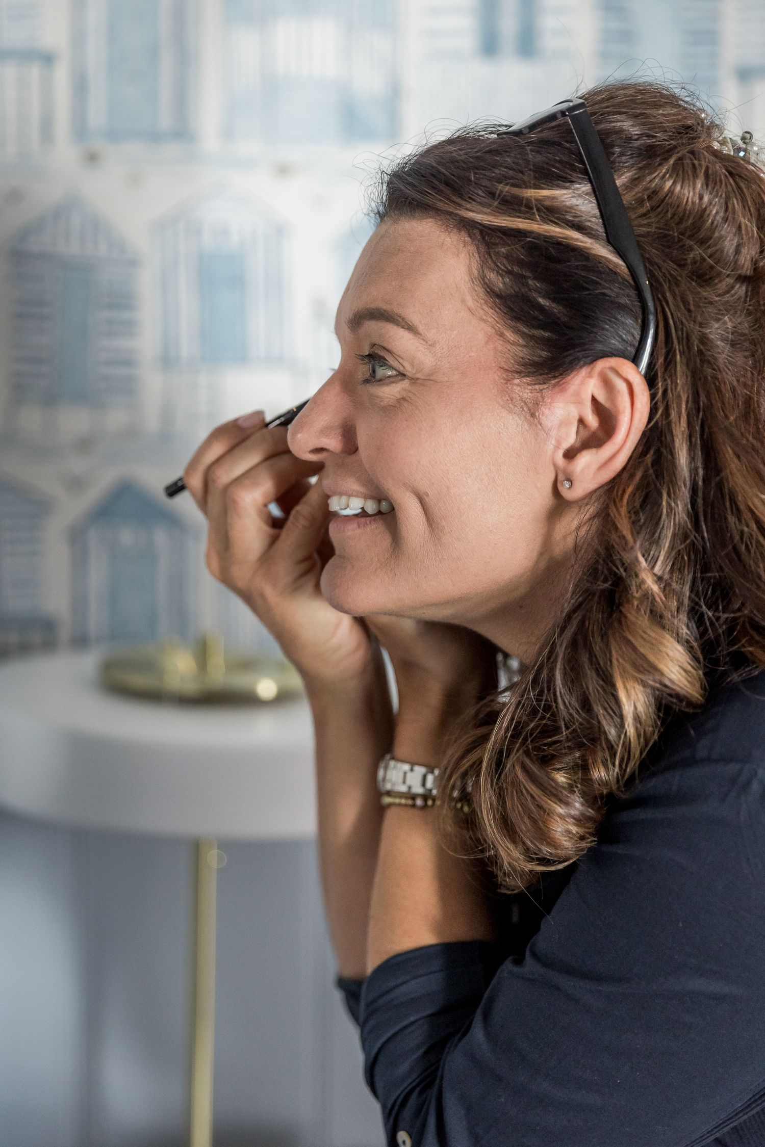 A series of candid laughing expressions showing genuine joy and emotion.