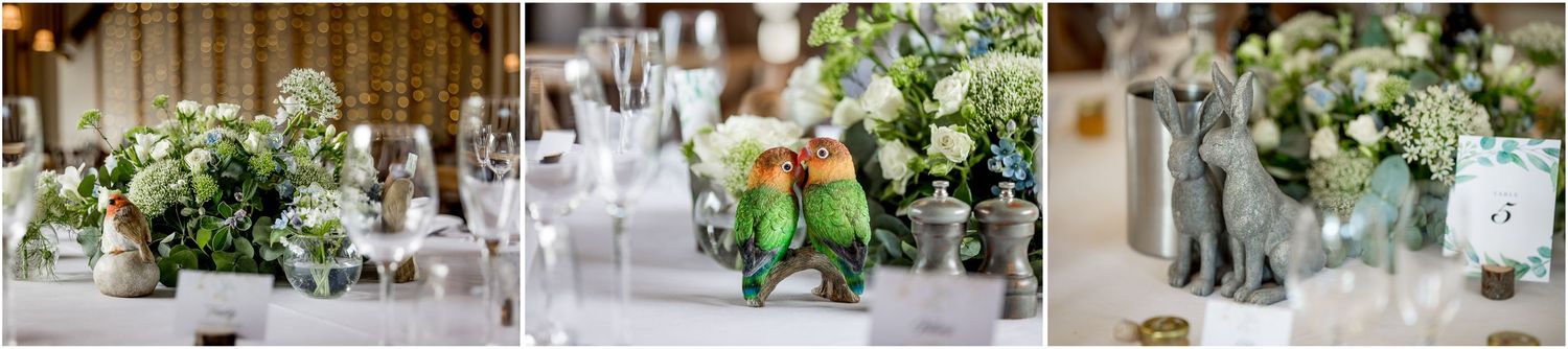Elegant wedding reception table settings with white and green floral centerpieces in glass vases.