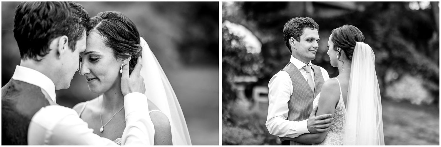 Romantic black and white wedding portraits showing intimate moments between the couple in an outdoor setting.