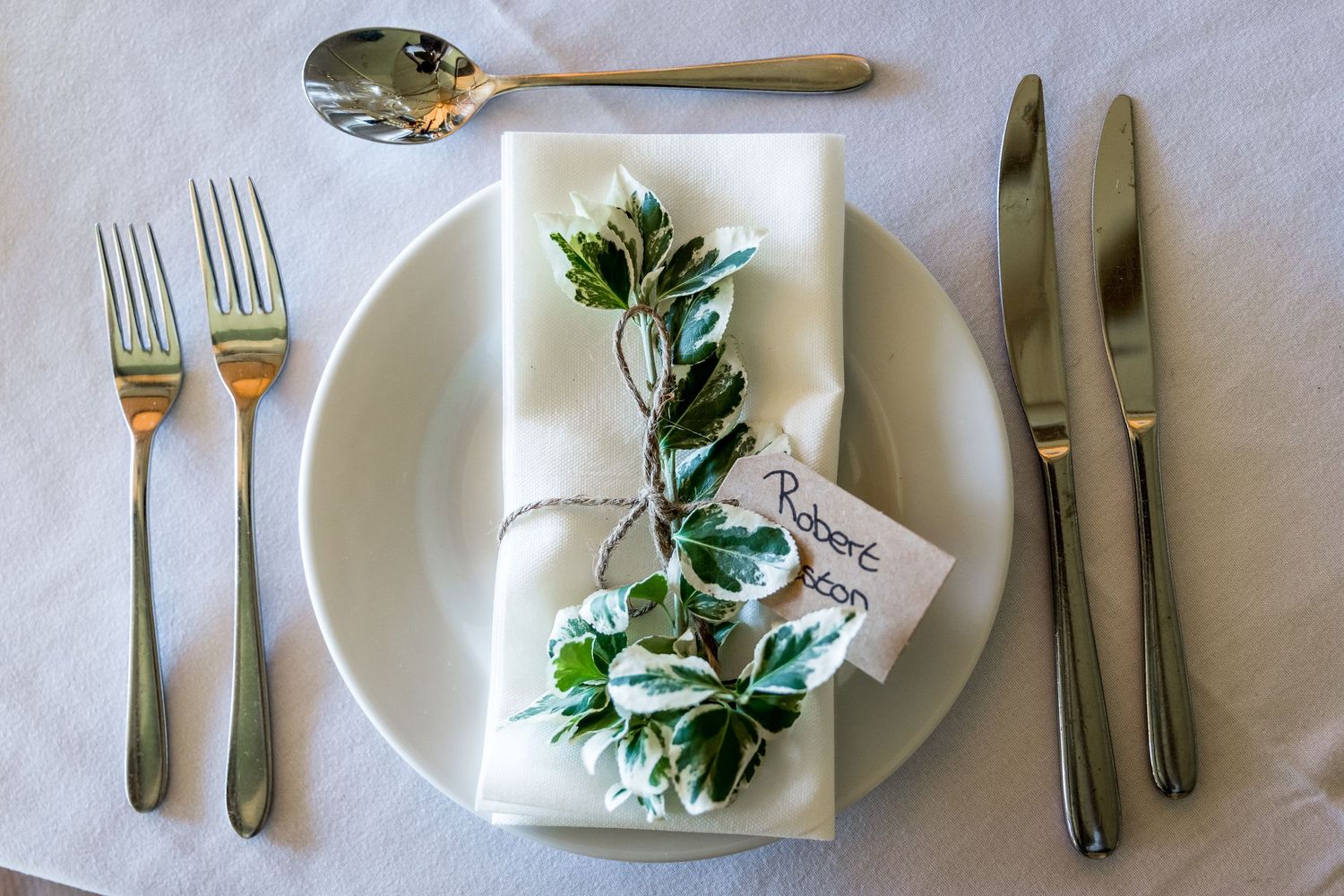 Classic and elegant table place settings f photographed or a wedding breakfast at the Holwell Estate in Hampshire
