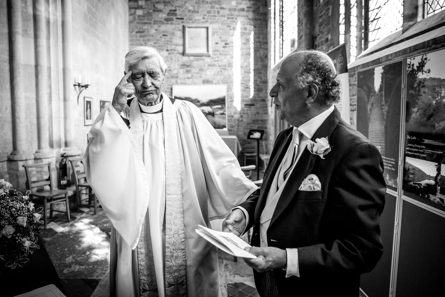 Black and white candid moments captured during wedding preparations.