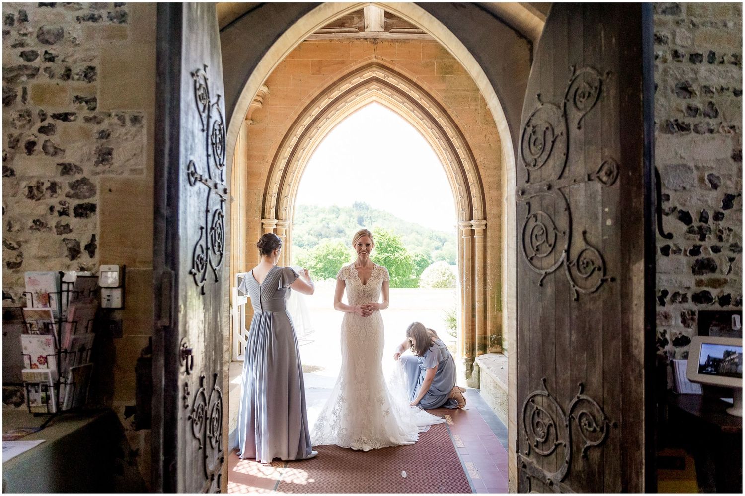 Stone church archway entrance with natural light streaming through.
