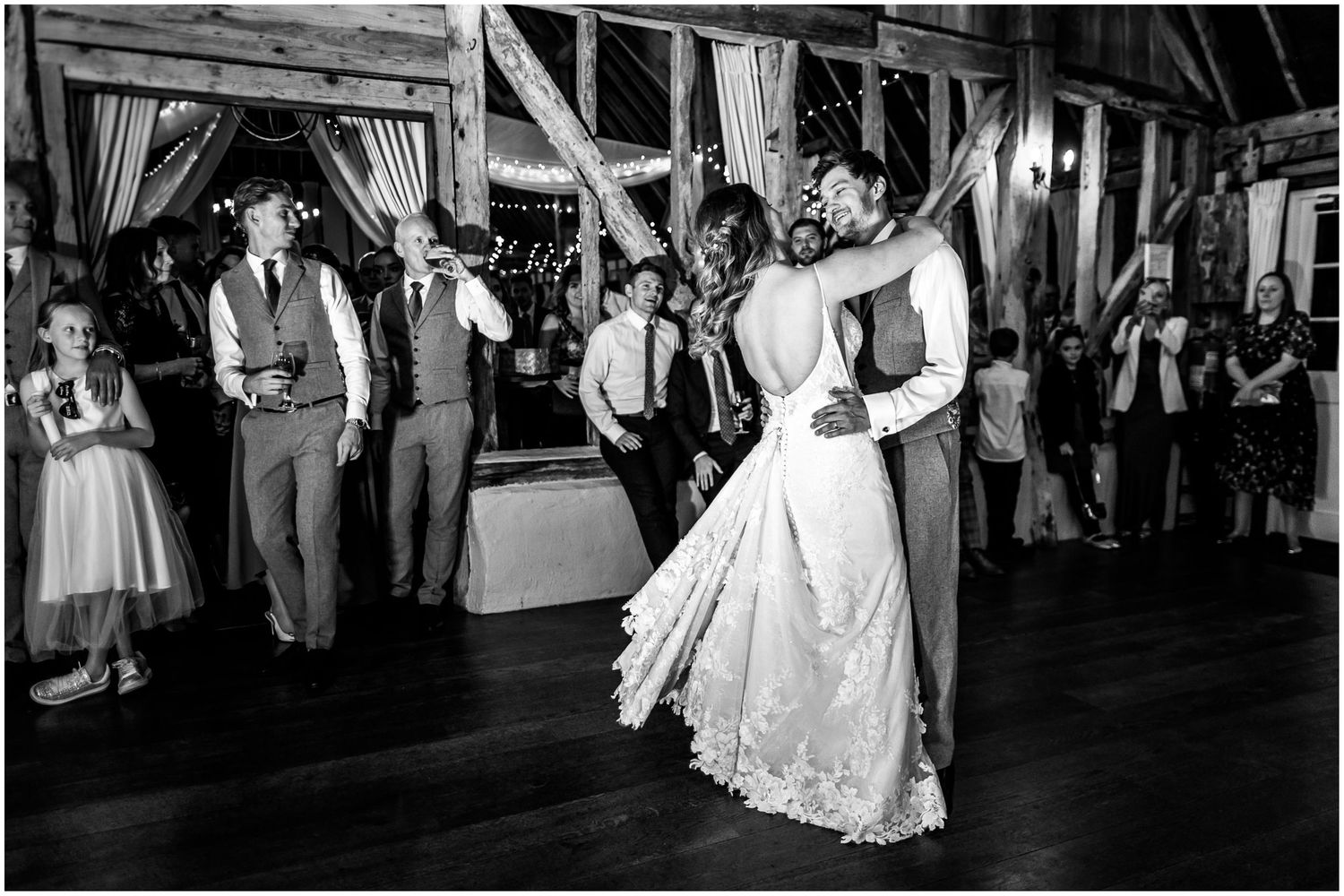 Black and white wedding photography of a bride and groom's first dance at Clock Barn near Whitchurch in Hampshire