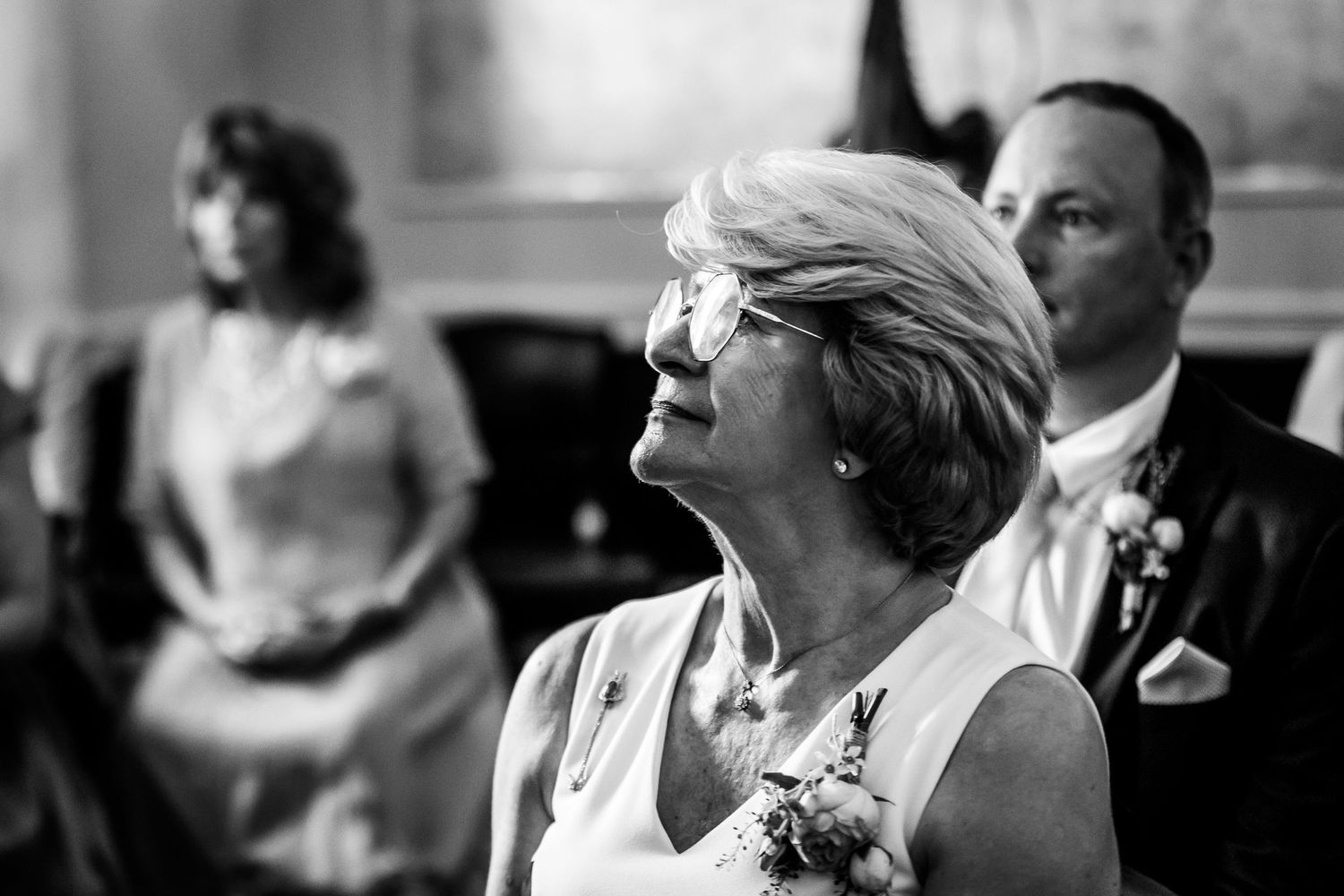 Guests enjoying a formal event in an elegant indoor setting.