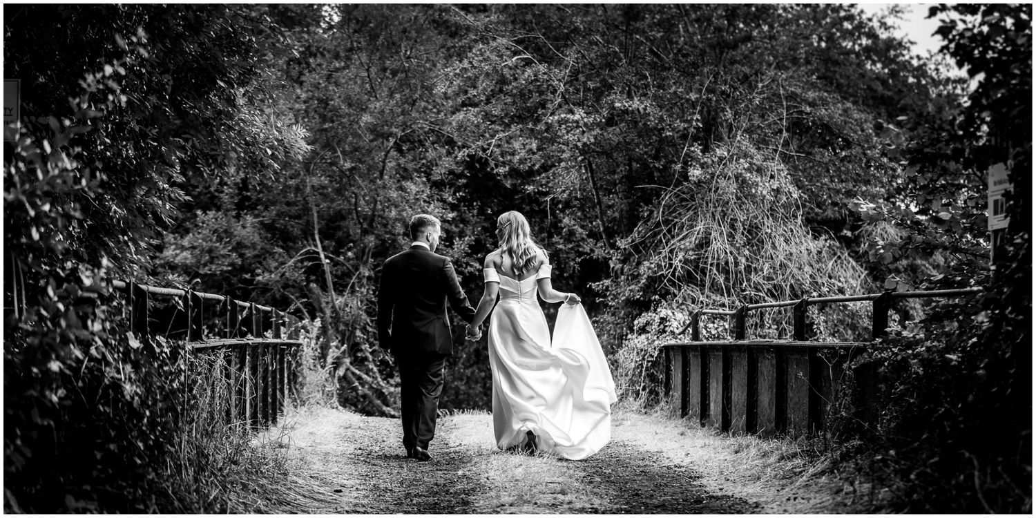 Artistic black and white wedding photography sequence in a natural setting.