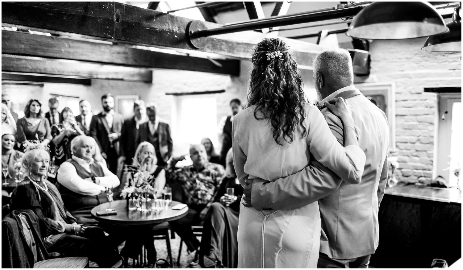 Bride and groom stand together during their wedding blessing ceremony at Winchester Abbey Mill.