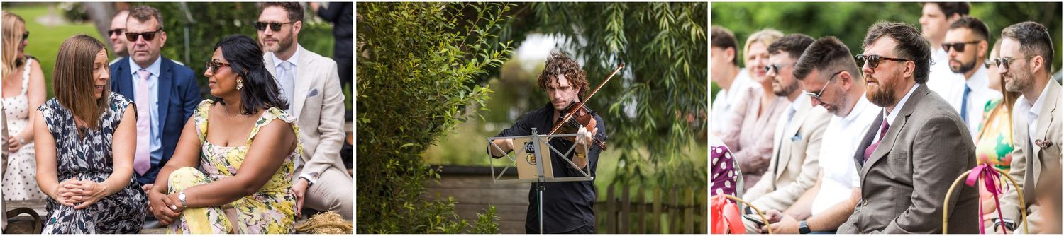 A violinist plays at the start of the outdoor ceremony at Sopley Mill in the New Forest