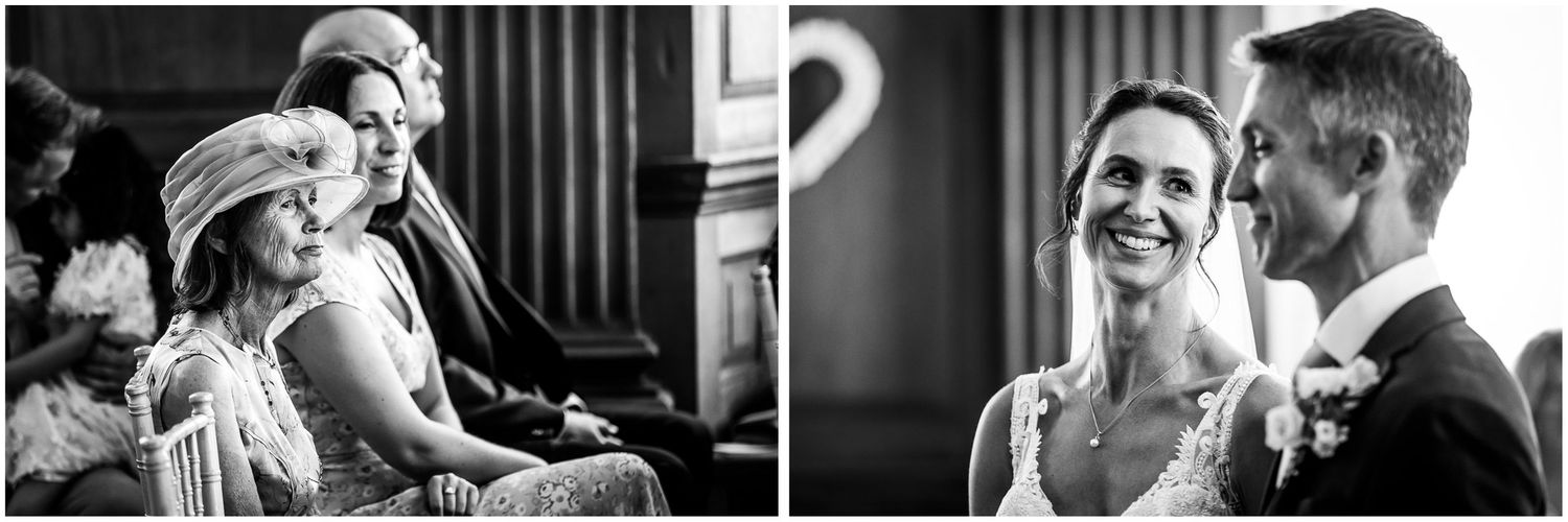 Black and white wedding ceremony photo at Walhampton School in the New Forest, with a smiling bride