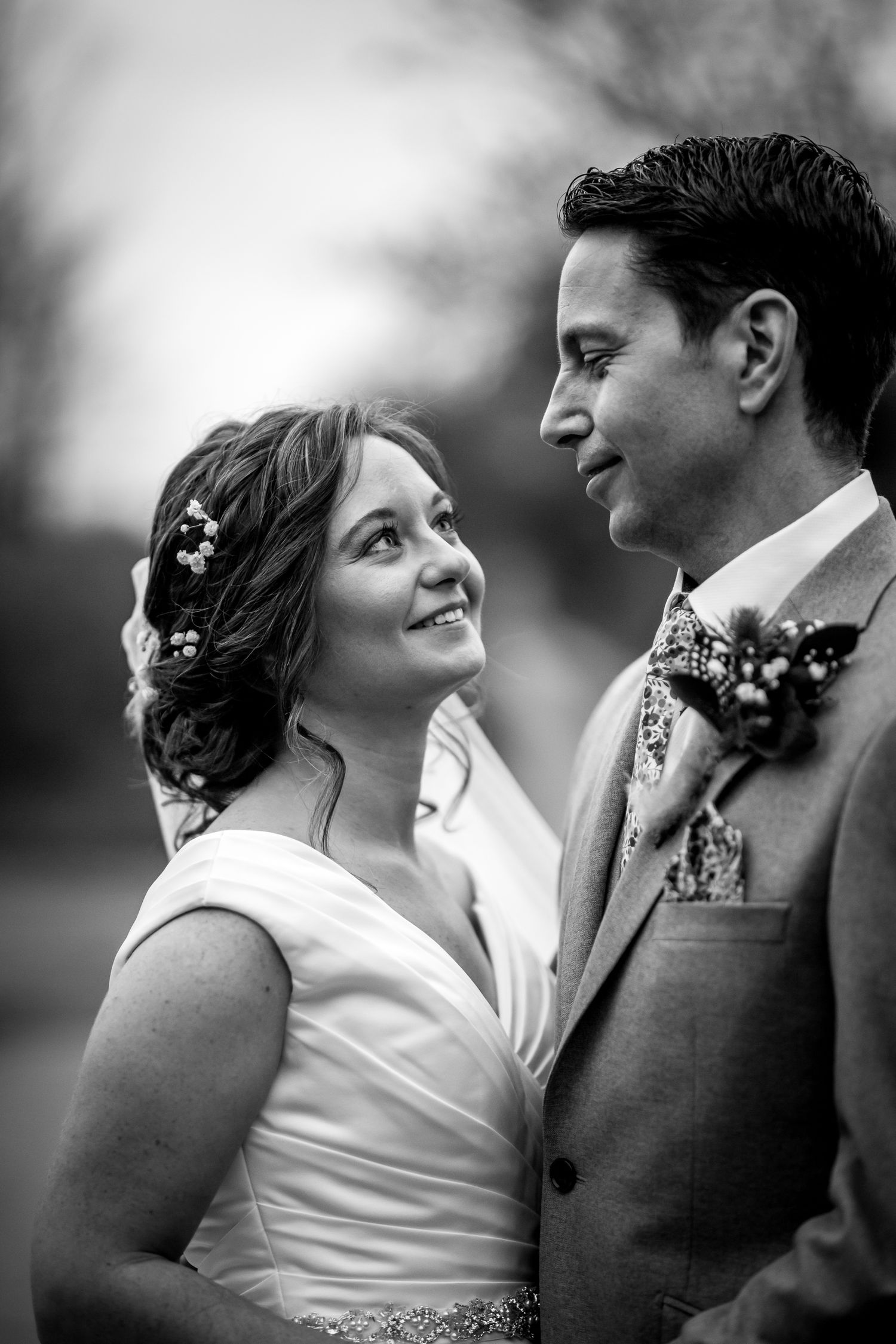 Black and white bride and groom Winter wedding portrait in the gardens of Clock Barn