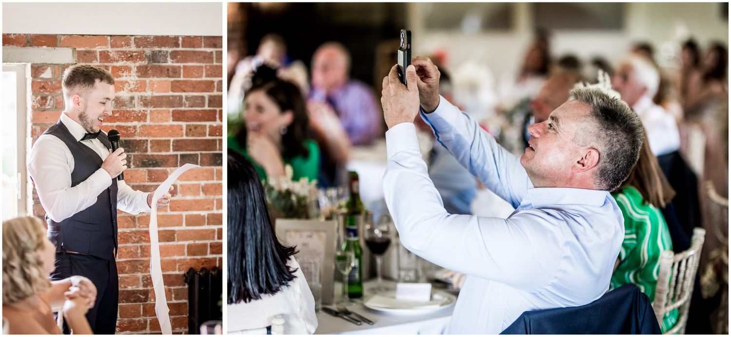 Wedding guests raising glasses in celebration at rustic brick venue.