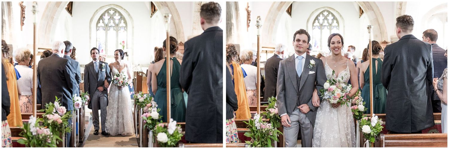 Wedding party gathered inside a traditional church with gothic architecture.