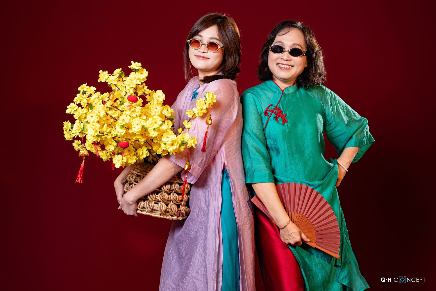 Artistic portrait series with colorful traditional Asian costumes and props against deep red background.