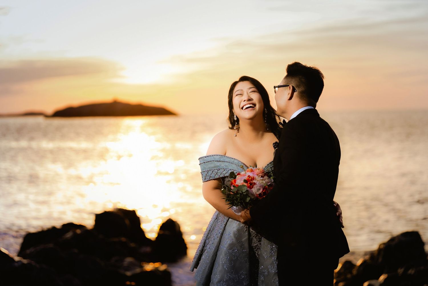 Coastal sunset wedding photography with golden light and ocean views.