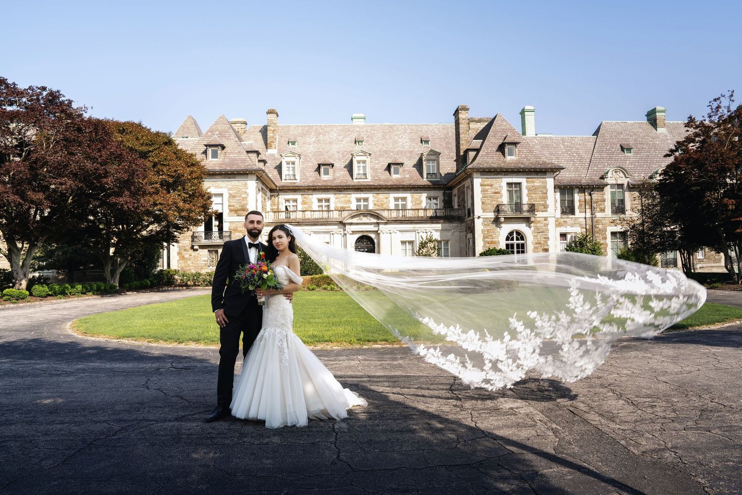 A series of elegant wedding photographs captured at a grand historic estate with manicured gardens and stone architecture.