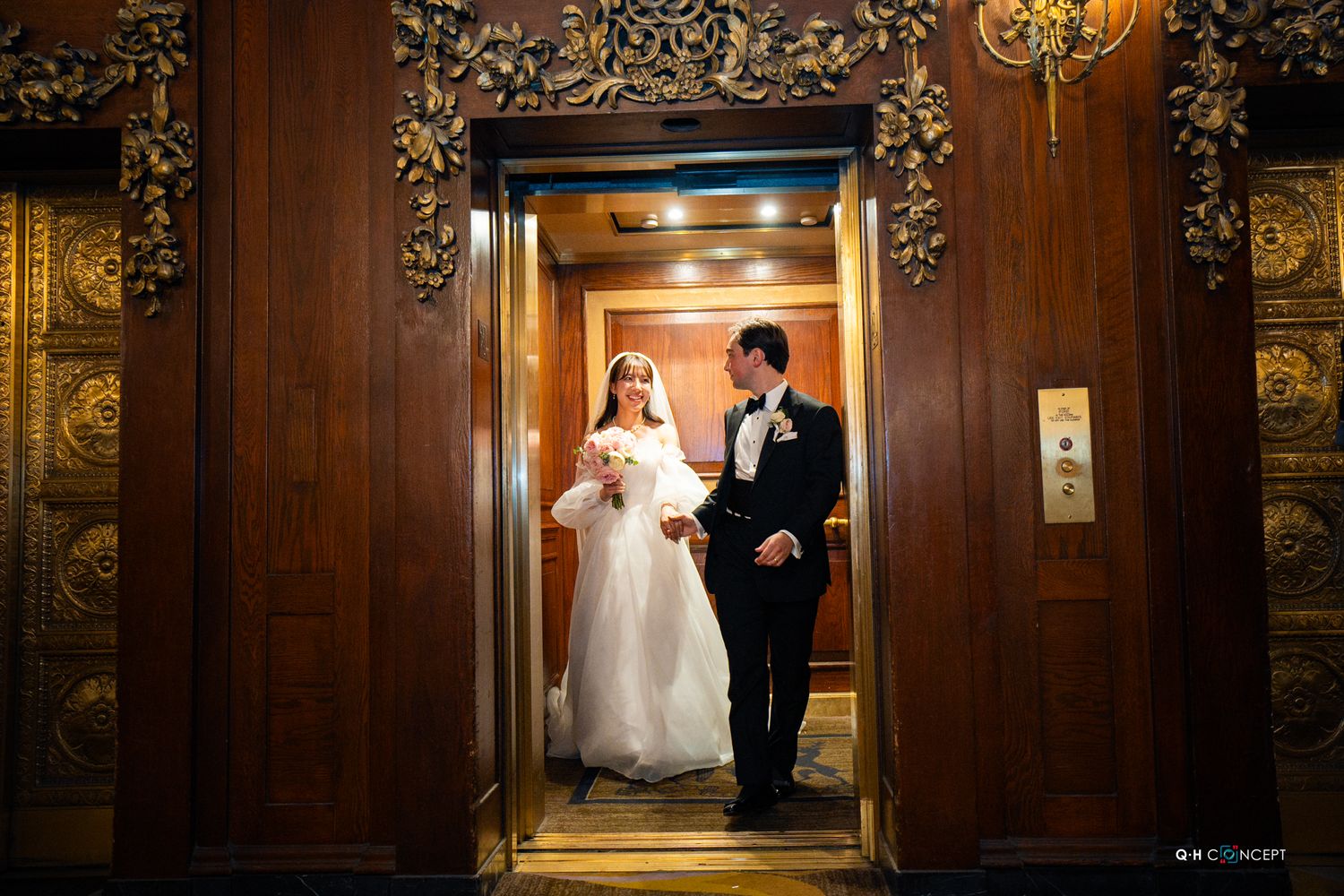 Elegant wedding photos in an ornate wood-paneled hallway with gilded details.