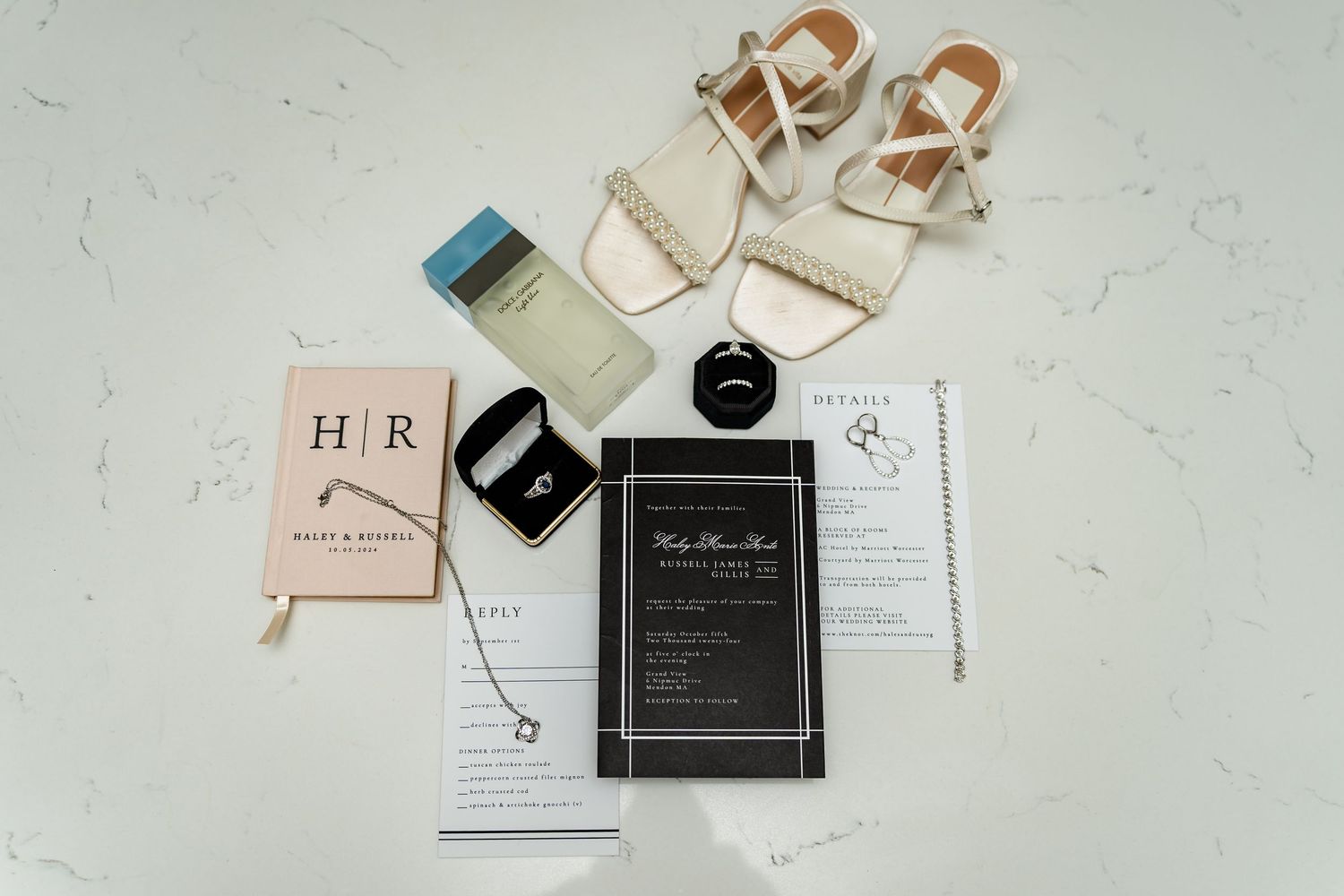Wedding invitation suite featuring elegant cards and paper goods in neutral tones.