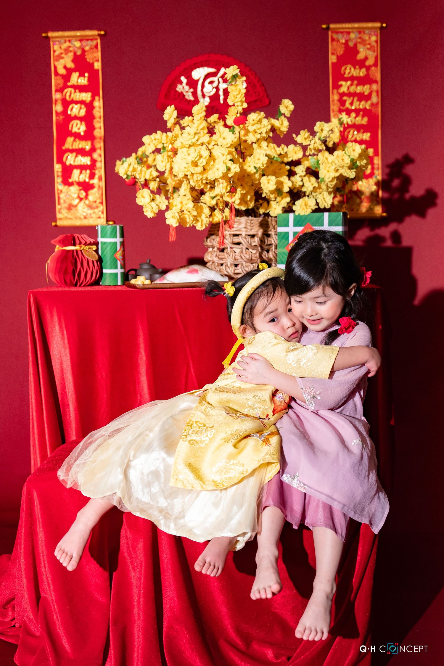 A festive red and gold decorated room with traditional Lunar New Year decorations and ornaments.