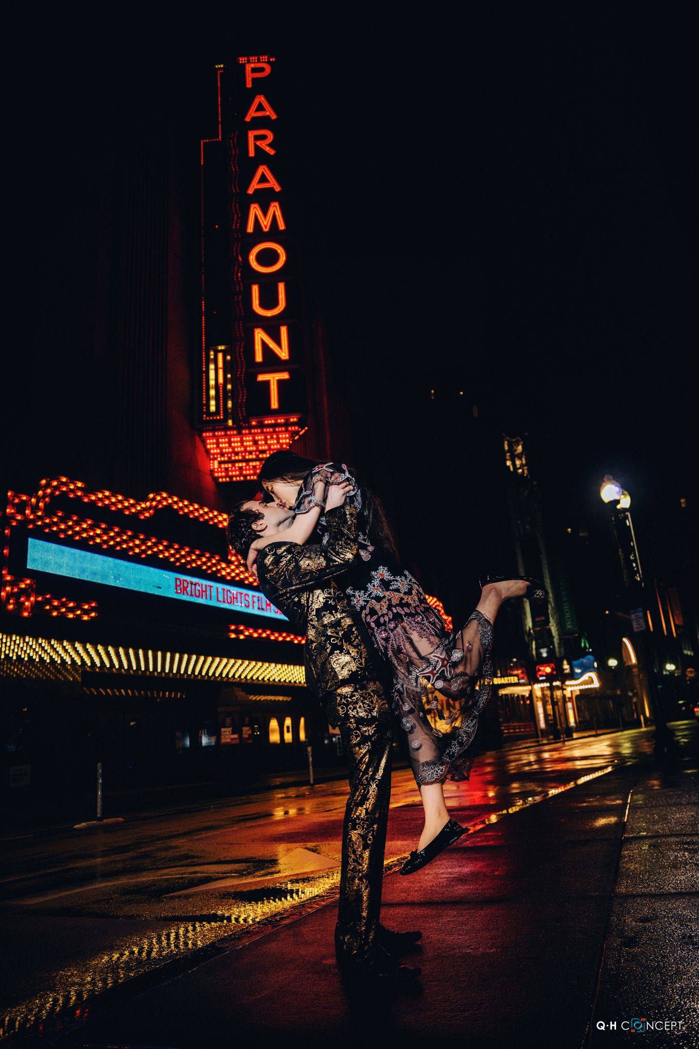 Artistic nighttime wedding photos with red neon signs and dramatic lighting.