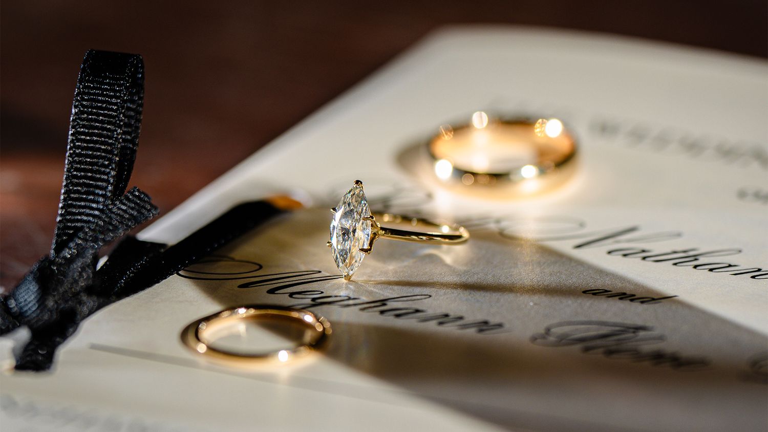 Gold wedding rings rest on a white paper with elegant calligraphy text in a collage of five similar images.