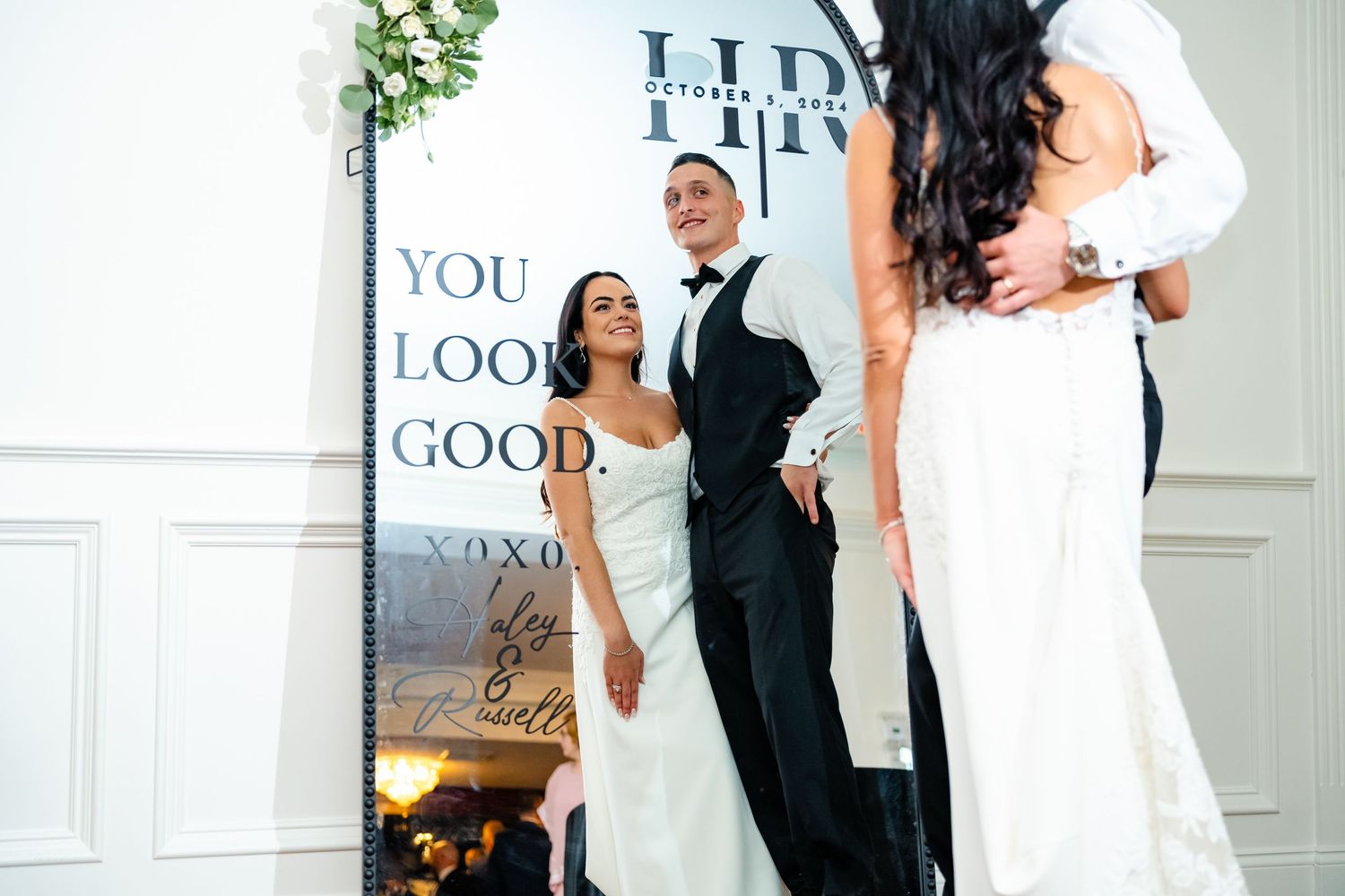 Elegant black and white wedding photos showing couples dancing and embracing in a romantic sequence.
