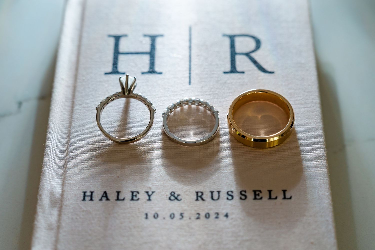 Wedding rings and monogram details with 'Haley & Russell' text.