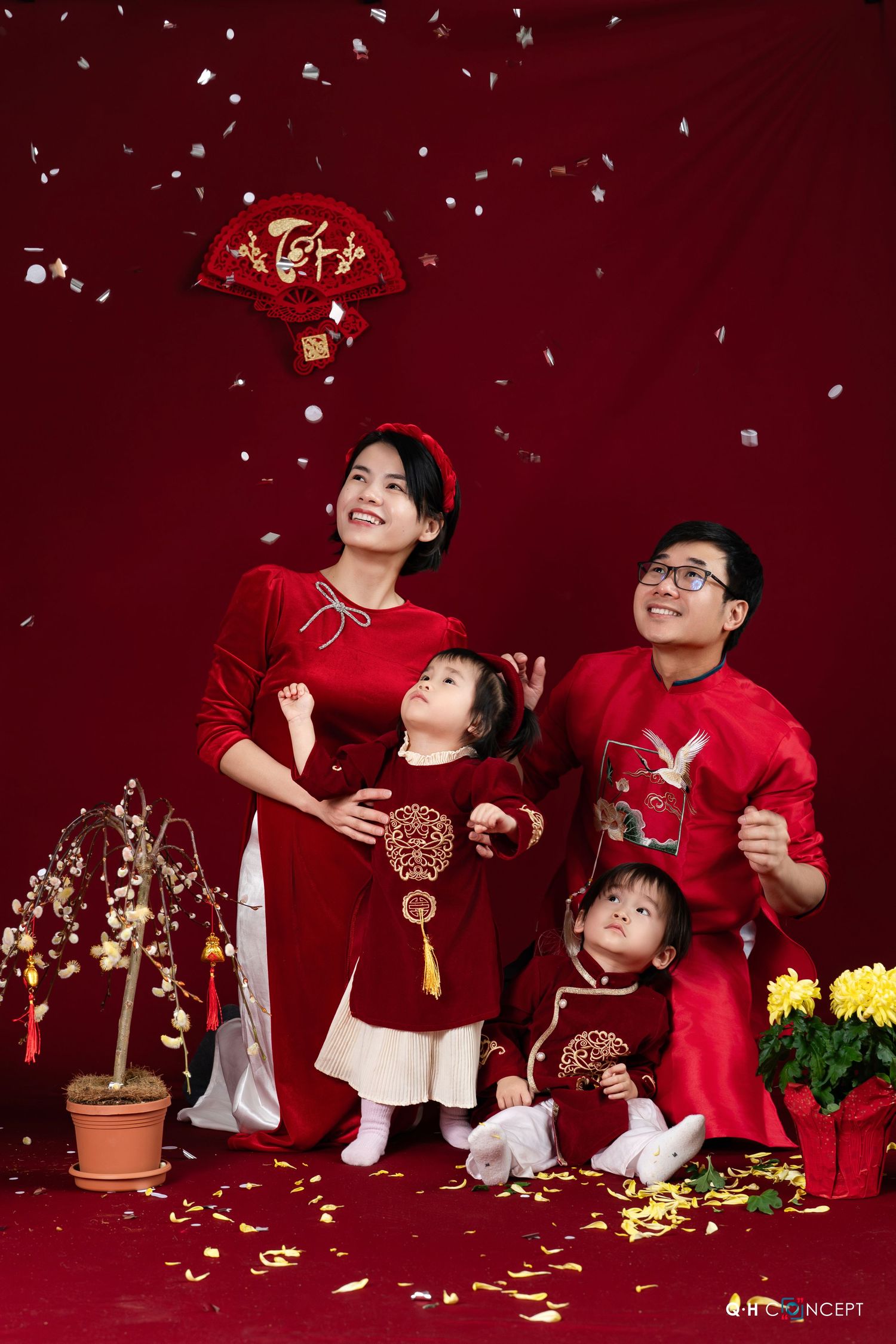 A festive Lunar New Year photo series with red and gold decor showing joyful moments and flower petals scattered in the air.