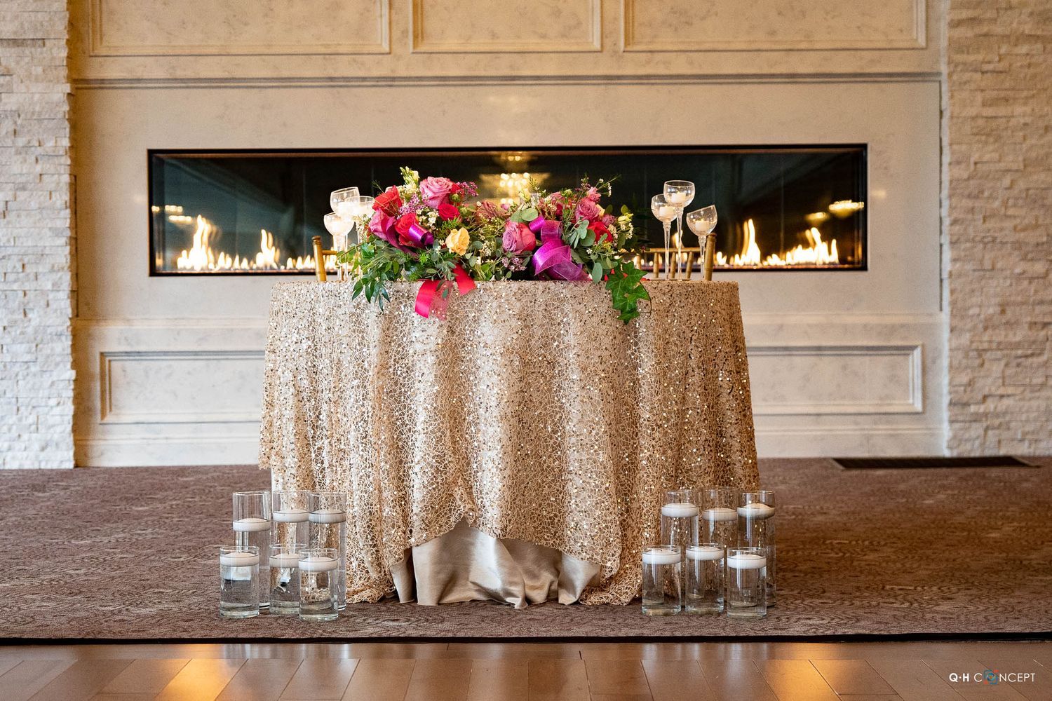 Modern banquet hall with gold accents, marble details, and ambient lighting for upscale events.