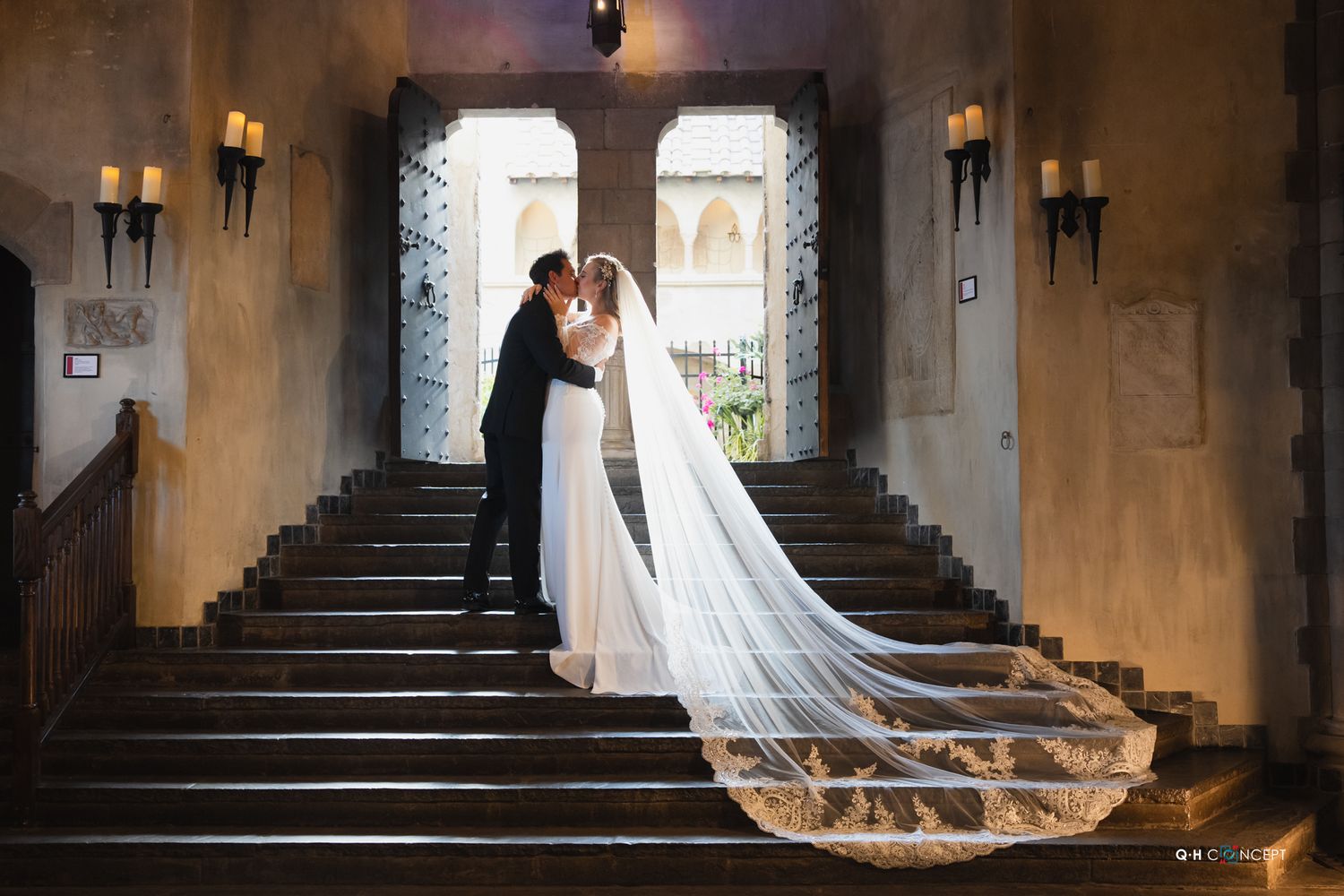 Wedding photos in a gothic church interior with dramatic lighting and long flowing veil.