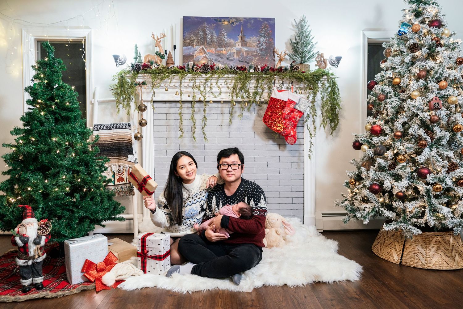Decorated Christmas trees with white and red ornaments line a bright room with festive holiday decor.